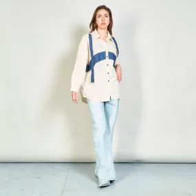 Button-up shirt with denim strap accents wholesale